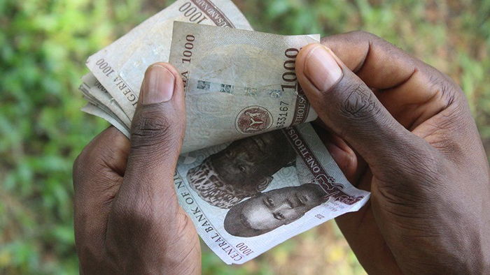 Đồng naira mất giá khiến nhiều người Nigeria tìm sang Bitcoin để giữ tiền. Ảnh: Getty Images.